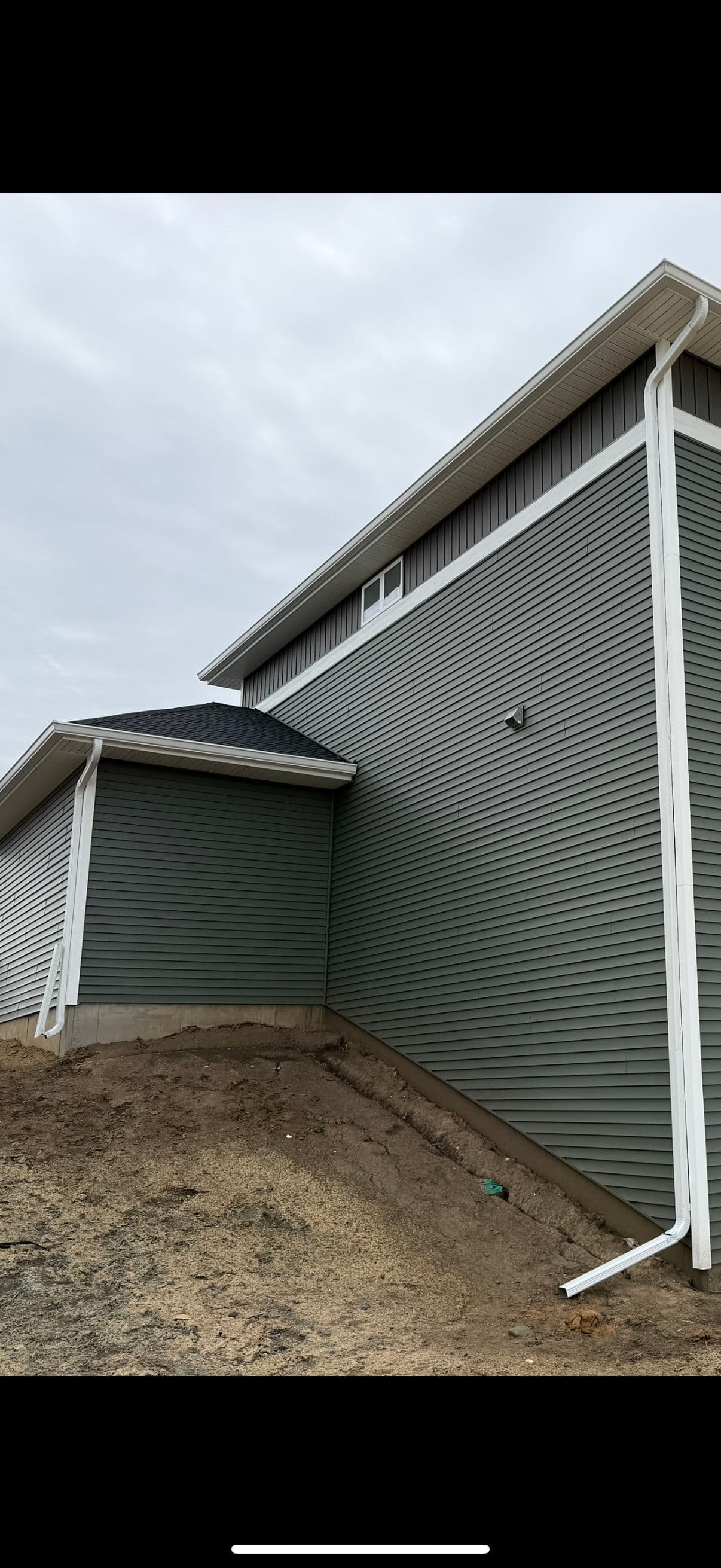 Why New Construction Downspouts Need Proper Drainage Tie-Ins image